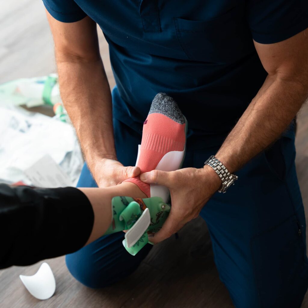 Orthotist fitting a custom hand splint